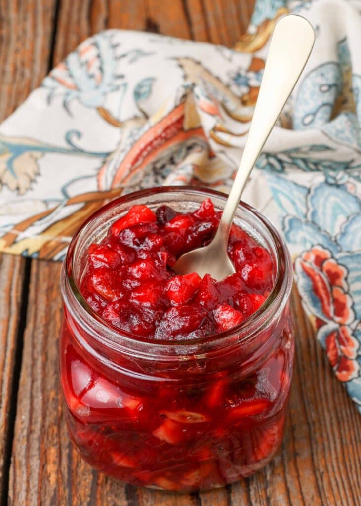 Cranberry Chutney with apples and raisins in jar