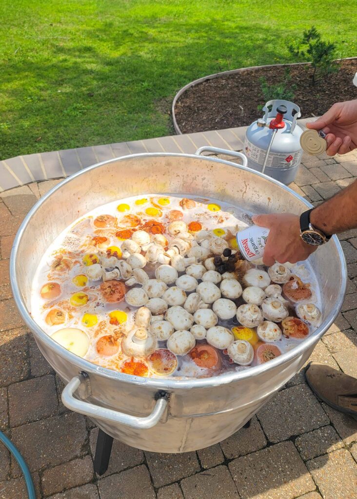 vegetables being added to crawfish boil