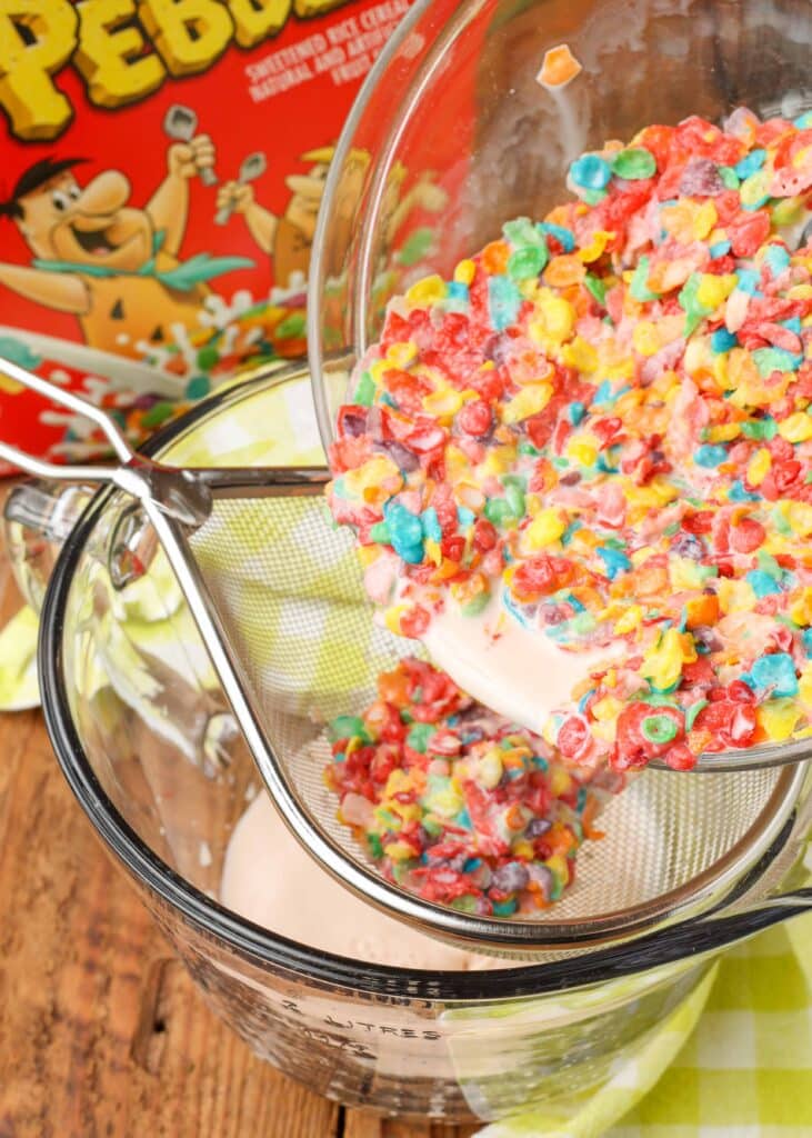 Straining liquid from milk and Fruity Pebbles cereal