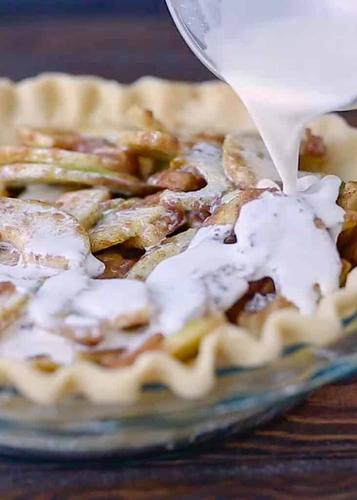 With little more than a pie crust, apples, cinnamon sugar spices, and a bit of cream, you can make an unforgettable German Apple Pie!