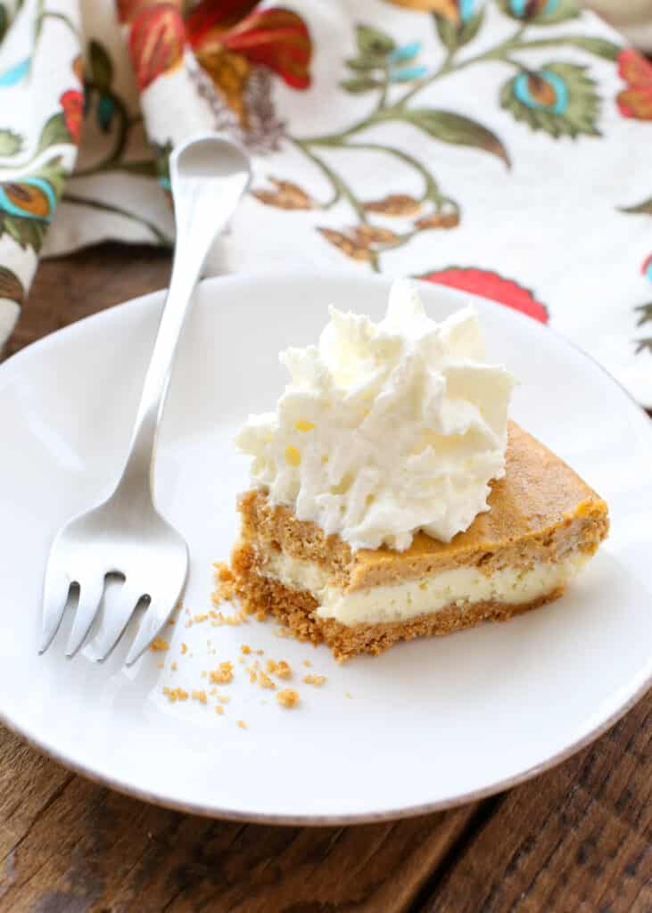 Pumpkin Cheesecake Layered Pie is a holiday favorite! get the recipe at barefeetinthekitchen.com