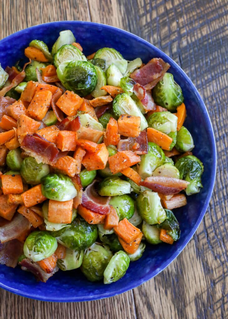 Roasted sweet potatoes with Brussels sprouts and bacon is a fantastic side dish for any meal